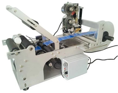 L & M Automatics - GENERAL/PACKAGING MACHINE - SEMI - AUTOMATIC LABELLING MACHINE